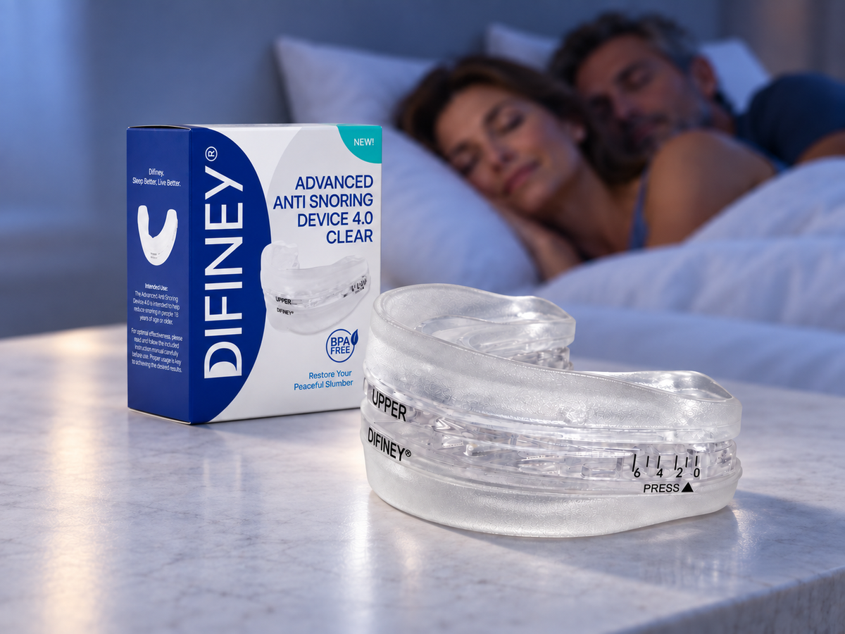 DIFINEY 4.0 mouthpiece and box on a nightstand beside a sleeping couple